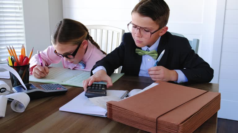 Two Young Accountants At Work