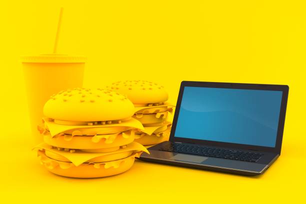 istock Fast food background with laptop 1097566142