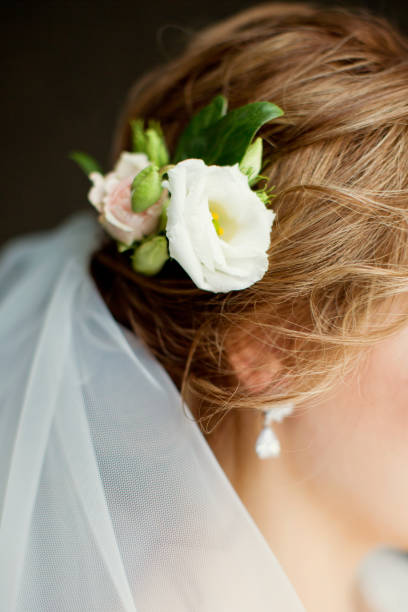 istock bride's hair with flowers 1097566534