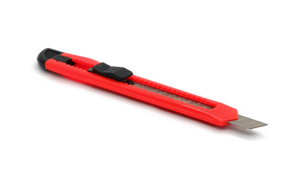 istock A red plastic knife with a retractable blade for paper isolated on a white. 1097566986