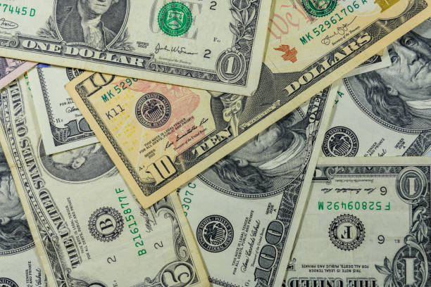 istock Background of different american dollar banknotes 1097569572