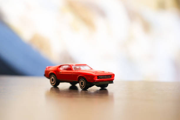 istock Colored small car toy on a wooden table 1097574988