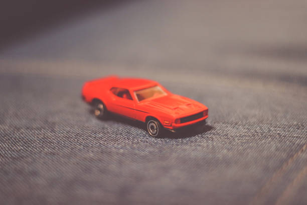 istock Colored small car toy on a wooden table 1097575148