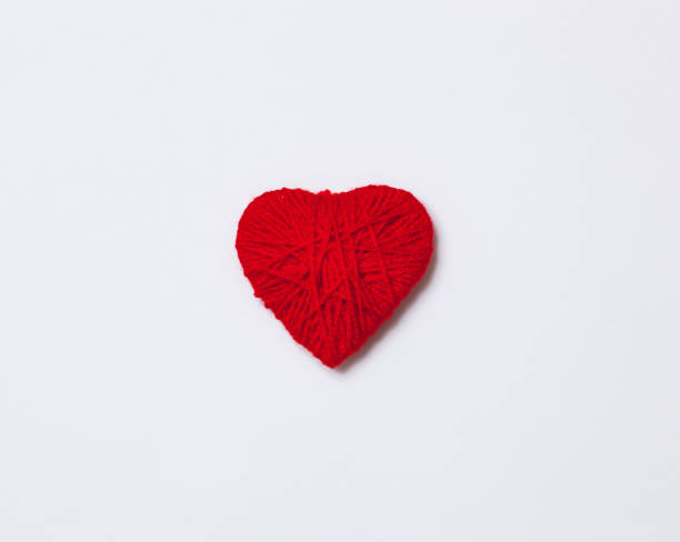 istock red yarn heart isolated on white 1097575274