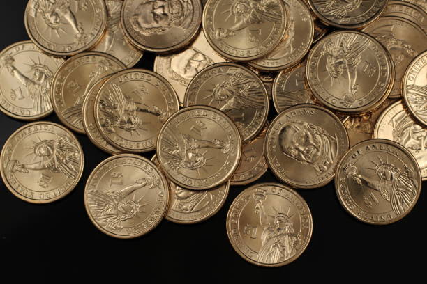 istock American golden dollar coins close up 1097577486