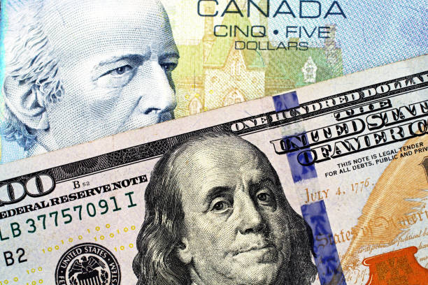 istock A blue Canadian five dollar bill with an American one hundred dollar bill 1097578478