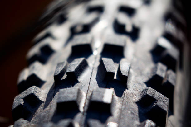 Mountain Bike Tire Tread A close-up view of the tread of a mountain bike tire. tire vehicle part photos stock pictures, royalty-free photos & images