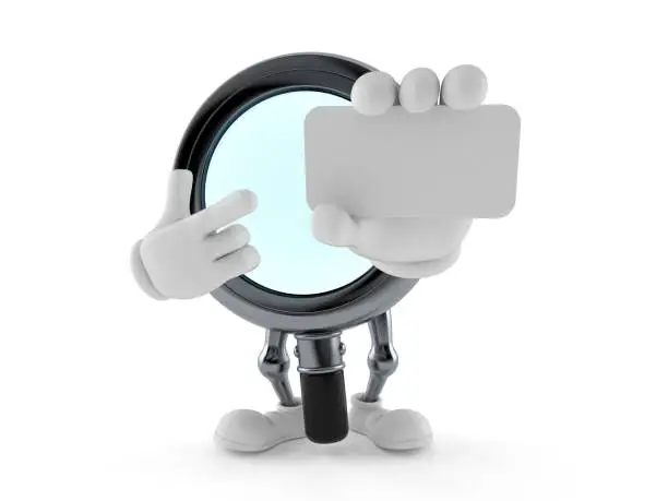 Photo of Magnifying glass character holding blank business card