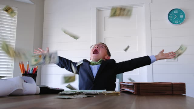 Young Boy Businessman Throwing Money