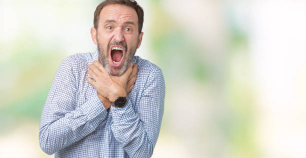 istock Handsome middle age elegant senior man over isolated background shouting and suffocate because painful strangle. Health problem. Asphyxiate and suicide concept. 1097586472