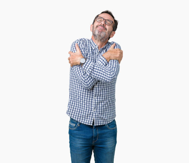 istock Handsome middle age elegant senior man wearing glasses over isolated background Hugging oneself happy and positive, smiling confident. Self love and self care 1097586972