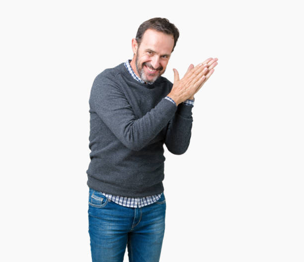 istock Handsome middle age senior man wearing a sweater over isolated background Clapping and applauding happy and joyful, smiling proud hands together 1097587000