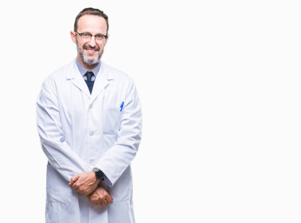 istock Middle age senior hoary professional man wearing white coat over isolated background with a happy and cool smile on face. Lucky person. 1097599394