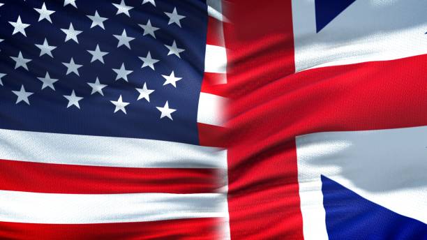 istock United States and Great Britain flags background, diplomatic economic relations 1097601452