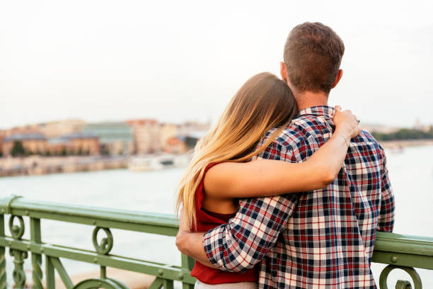 istock Young loving couple hugging in the street. 1097601562