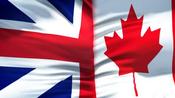 istock Great Britain and Canada flags background, diplomatic and economic relations 1097601722