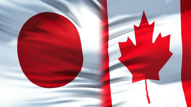 istock Japan and Canada flags background, diplomatic and economic relations, trade 1097602058