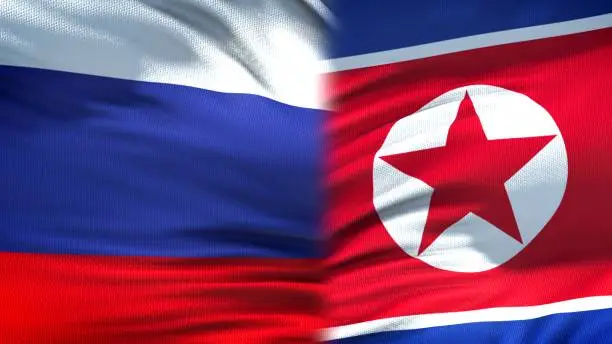 Russia and North Korea flags background, diplomatic and economic relations