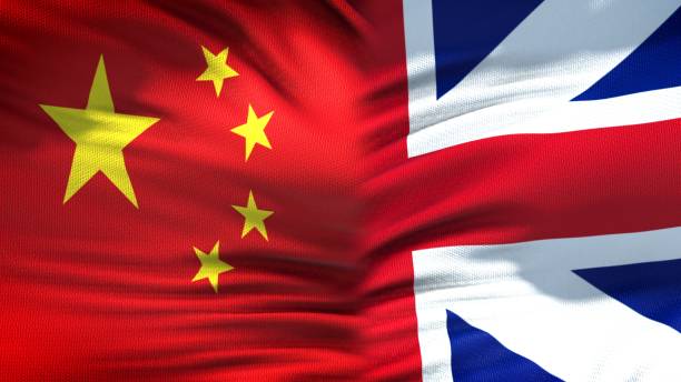 istock China and Great Britain flags background, diplomatic and economic relations 1097602472