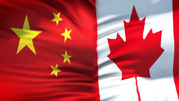 istock China and Canada flags background, diplomatic and economic relations, trade 1097602690