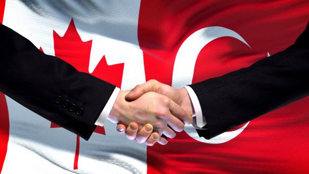istock Canada and Turkey handshake, international friendship relations, flag background 1097603062
