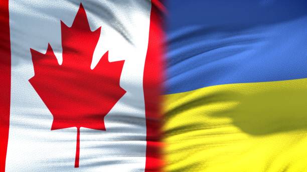 istock Canada and Ukraine flags background, diplomatic and economic relations, finance 1097603080