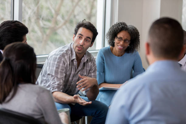 istock Animated employee speaks candidly during staff meeting 1097605956