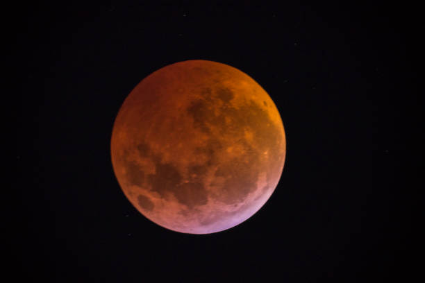 istock View of the Lunar eclipse trough a telescope from Buenos Aires, Argentina. 1097617062