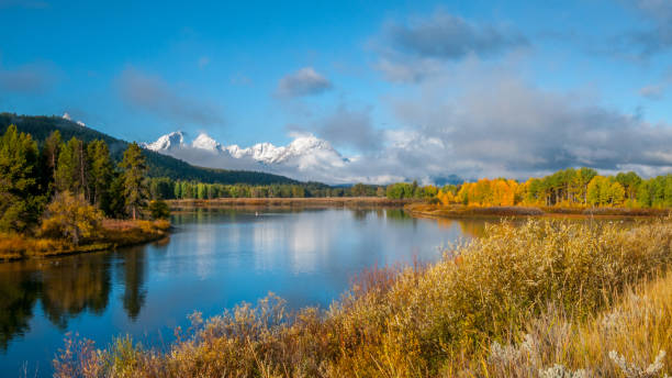 istock Oxbow Bend in the fall with cloud cover on the Teton Mountain Range 1097621728