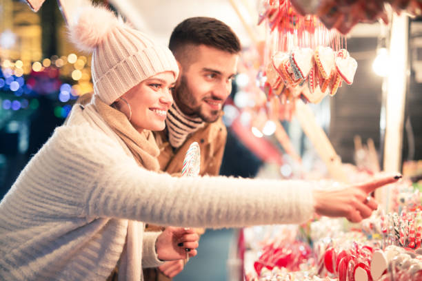 istock Young couple buying lollipops 1097625642