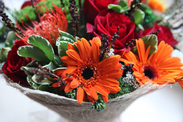 istock Bright bouquet with orange gerberas and red roses 1097629124