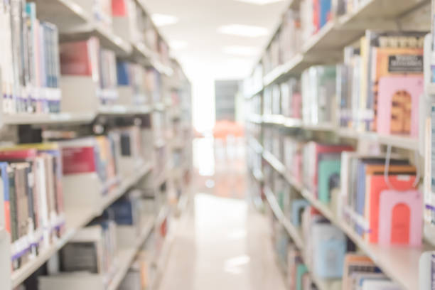 istock Blur school library or study room with book shelves for education background 1097629486