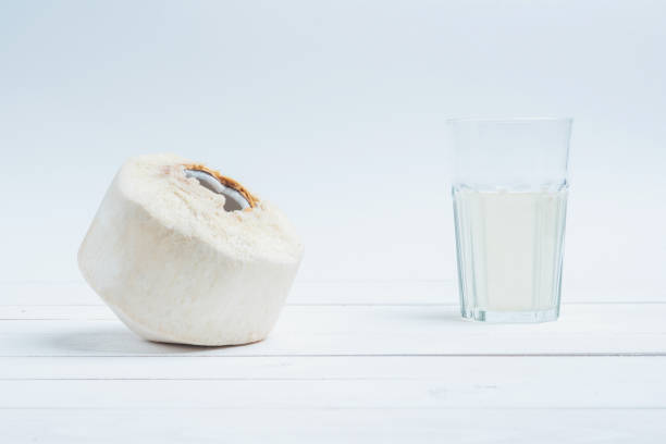istock Coconut with a glass of fresh coconut water. 1097630920