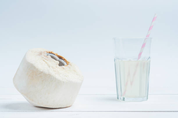 istock Fresh coconut and coconut milk in trasparent glass. 1097630940