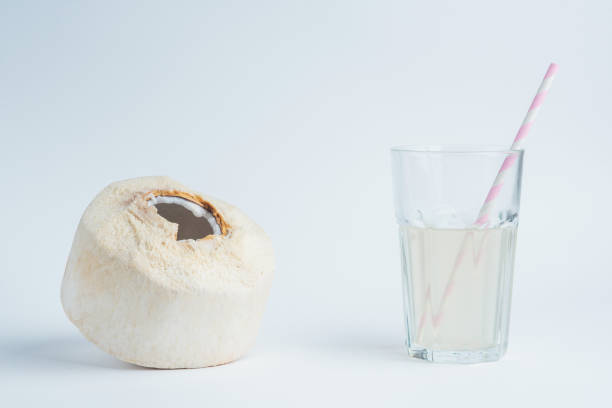 Fresh coconut and coconut milk in trasparent glass.