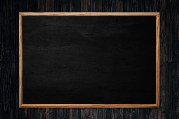 istock Abstract blackboard or chalkboard with frame on wooden background. 1097631352