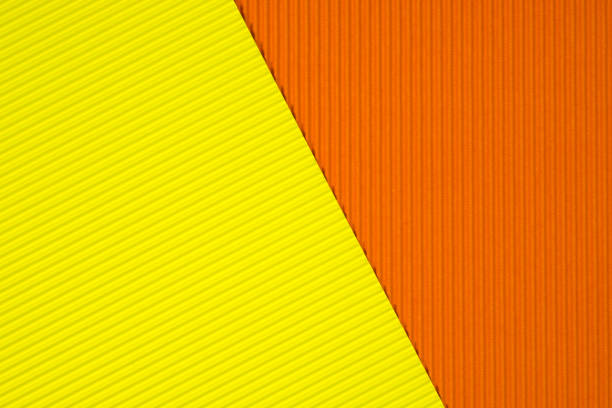 istock Yellow and orange corrugated paper texture, use for background. vivid colour with empty space for add text or object. 1097631382