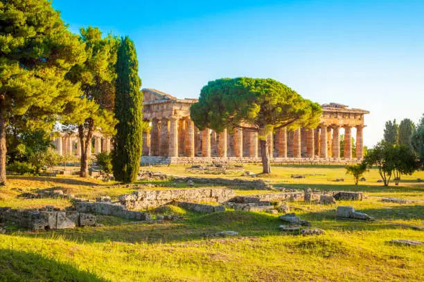 Paestum Temples Archaeological UNESCO World Heritage Site at sunset, Province of Salerno, Campania, Italy