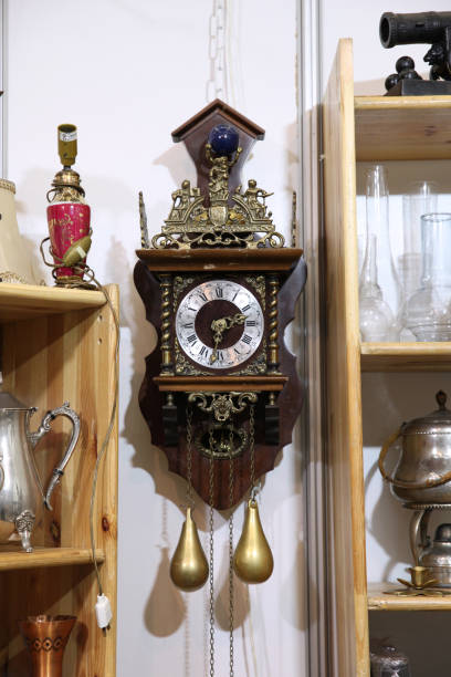 istock Antique wall clock with pendulum on the flea market 1097644844