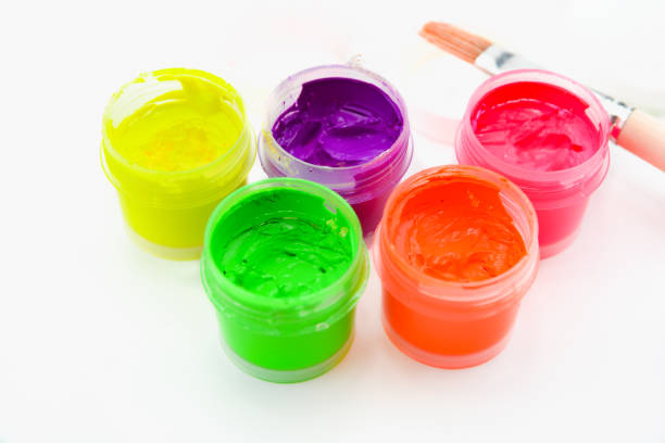 istock Jars with colorful gouache paint and brush isolated on white background 1097644956