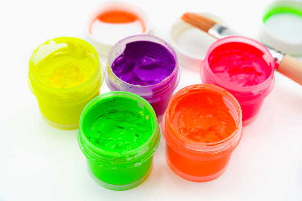 istock Jars with colorful gouache paint and brush isolated on white background 1097644974