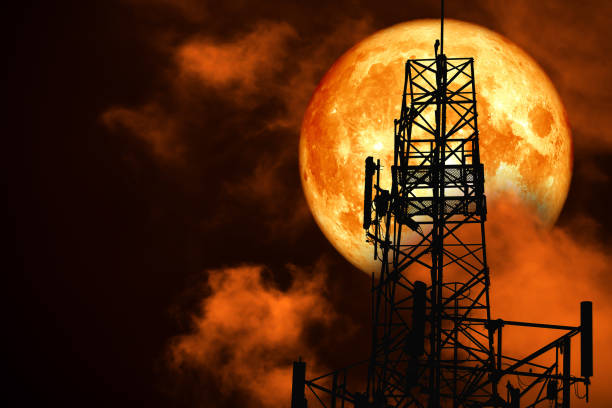 istock super blood moon back silhouette Antenna and night red cloud on sky 1097645000