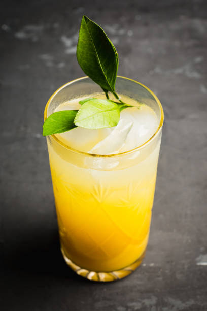istock Fresh cocktail with mandarines on the rustic background 1097646784