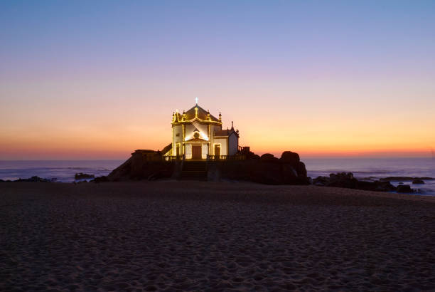 istock Church of Sr. da Pedra over the waves aat blue hour 1097648464