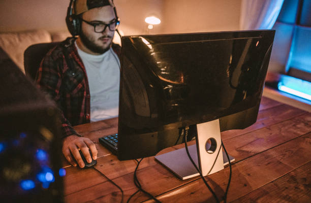 istock Teenager playing games on PC 1097651046