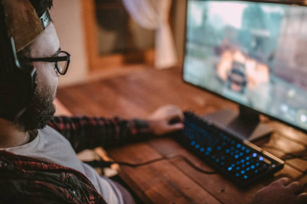 istock Teenager playing games on PC 1097651148