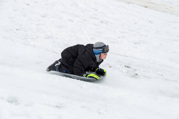 istock High Speed Sledding Down a Hill After a Snowstorm in Provo Utah 1097655820