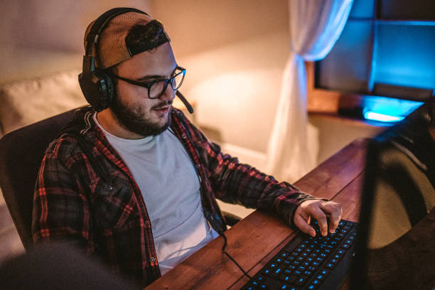 istock Teenager playing games on PC 1097656164