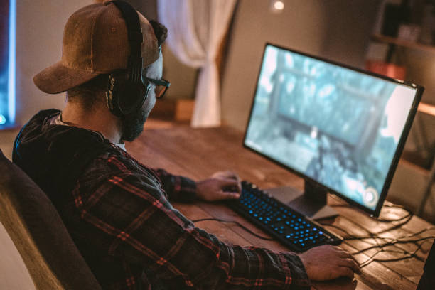 istock Teenager playing games on PC 1097656190