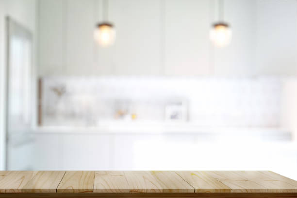 istock Empty wooden top table or cutting counter table in modern kitchen room background. For product or food montage 1097656470